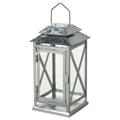 A BEFÄSTA lantern, silver in colour, with a square shape and geometric metal design, suitable for indoor and outdoor use.