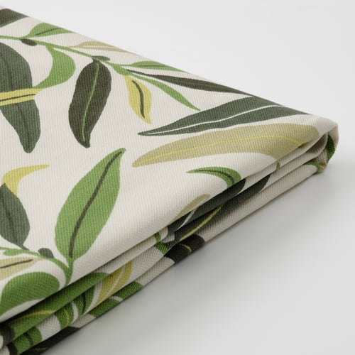 Folded fabric with green leaf pattern, high quality cotton, recycled polyester backing.