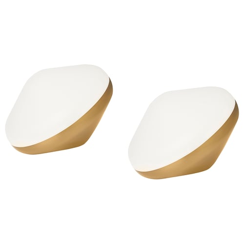 Two modern, white, oval-shaped lamps with brass bases, stylishly positioned side by side.