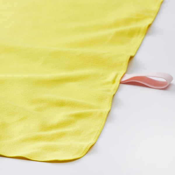 Bright yellow fitness towel with pink hanging loop, laid flat on white surface.