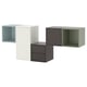 Four modern, cube-shaped storage units in light blue, white, dark grey, and green, arranged in a row.