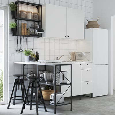 Modern ENHET kitchen: white cabinets, black accents, island with seating.