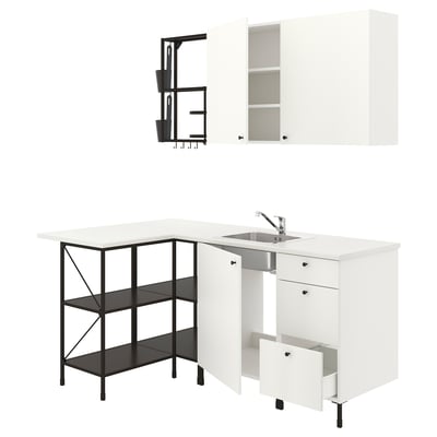 Modern white kitchen setup, including sink, cabinets, and shelves with black accents.