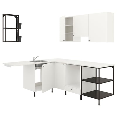 Modern white kitchen with black details, efficient design.