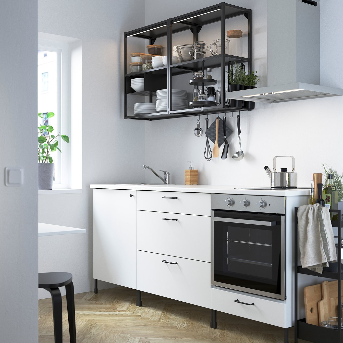 Modern white kitchen with ENHET, spacious drawers, integrated appliances, open shelving, stainless steel sink, streamlined for small spaces.