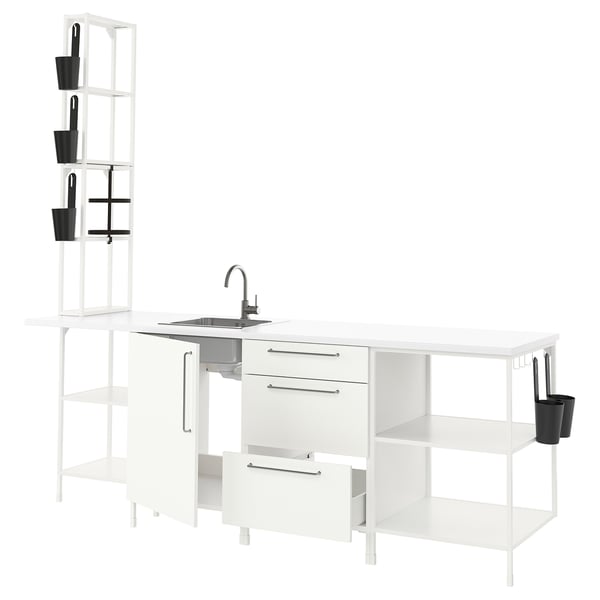 Modern white ENHET kitchen setup, clean design. Open shelves, sink, and storage units.