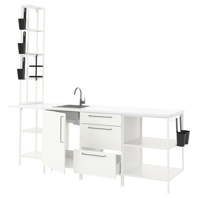 Modern white ENHET kitchen setup, clean design. Open shelves, sink, and storage units.