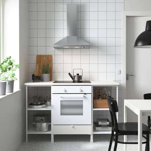 Compact ENHET kitchen with oven, shelves, hood, and plants.