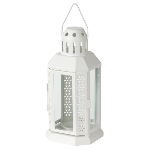 White octagonal ENRUM lantern with cutouts, steel & glass, warm glow, indoor/outdoor.