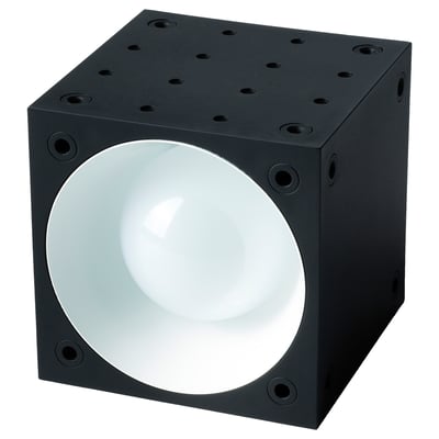 Black cube-shaped spotlight with large round white light in centre, surrounded by small holes.
