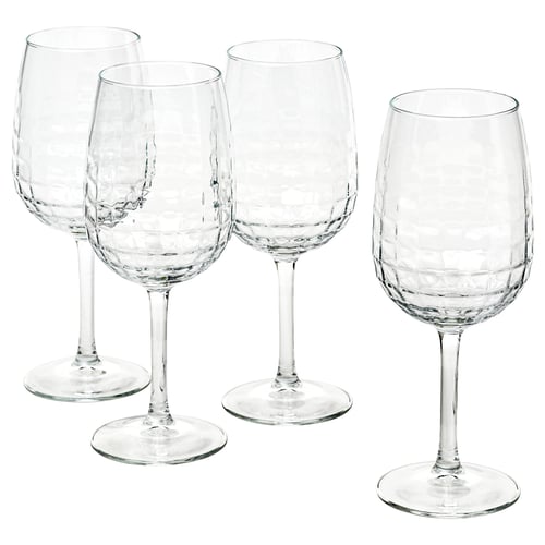 Four clear, faceted wine glasses in a set, made of glass. Elegant design, perfect for wine and special occasions.