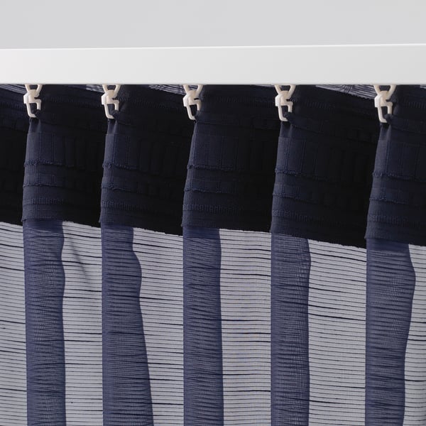 Curtain hooks on sheer privacy curtains.