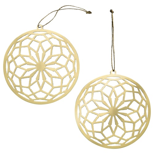 Two gold, round, hanging ornaments with intricate cut-out floral designs, made from stainless steel with jute string.