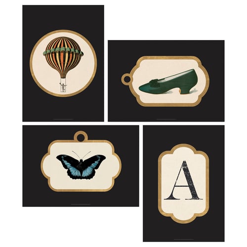 Four GRÖNBY framed art prints: balloon, shoe, butterfly, letter a; dark backgrounds, gold trim, rounded frames.
