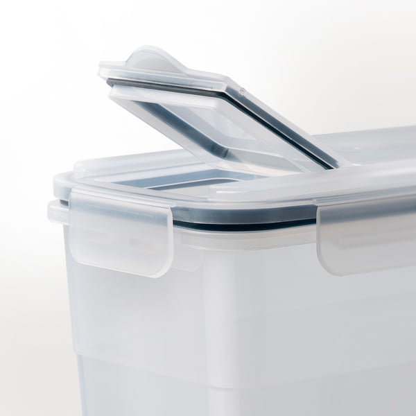 Clear plastic container with an airtight lid, featuring a spout for easy pouring and a silicone seal for freshness.