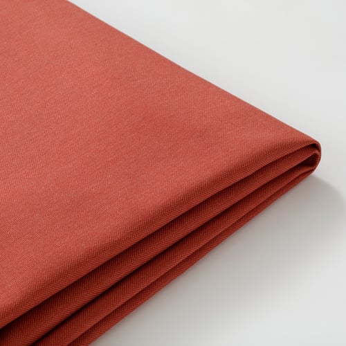 Red polyester fabric close-up, smooth texture, neatly folded.