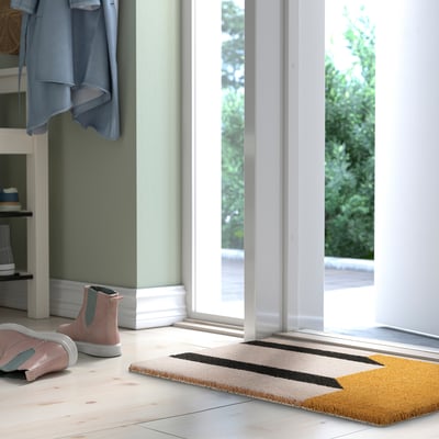 Colourful striped doormat KLOTOID in beige, black, mustard, rectangular, keeps dirt at entrance.