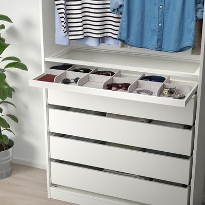 Closet with pull-out tray organising spectroscopy items. Dividers keep accessories neat.