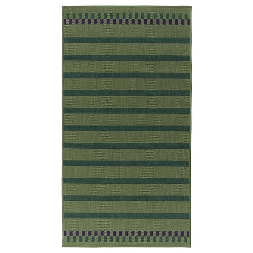 Green KORSNING rug with stripes and border, rectangular shape.