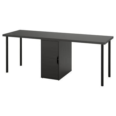 An IKEA LAGKAPTEN desk in black with a central storage cabinet, supported by metal legs.