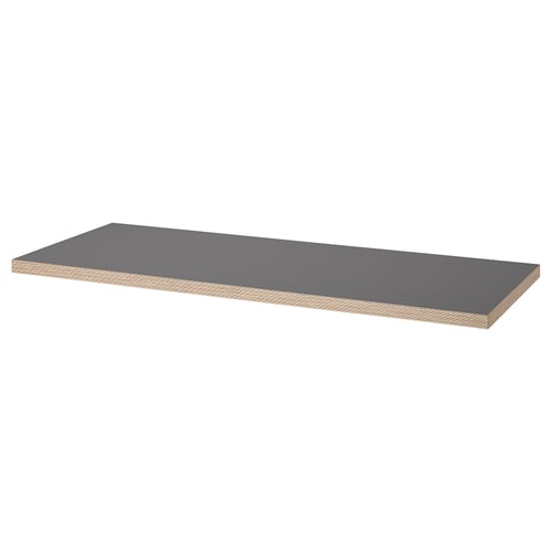 An ikea LAGKAPTEN table top. It is gray, rectangular, and made of fiberboard with acrylic paint.