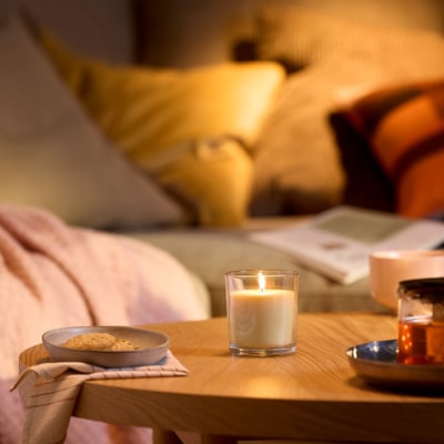 LOTSFÅGEL Scented candle in glass, Peach light orange, 40 hr