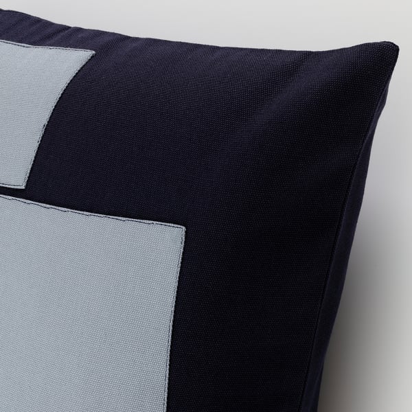 Square throw pillow with black and grey patches. Hidden zip closure, high-quality cotton.