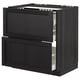 An open black stained wood kitchen cabinet with multiple drawers.