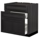Modern black wooden kitchen cabinet with bevelled drawers and storage.