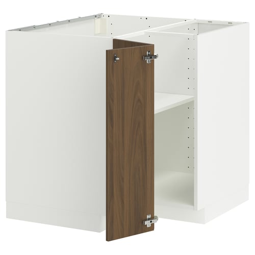 Modern white kitchen cabinet with walnut door, metal hinges.
