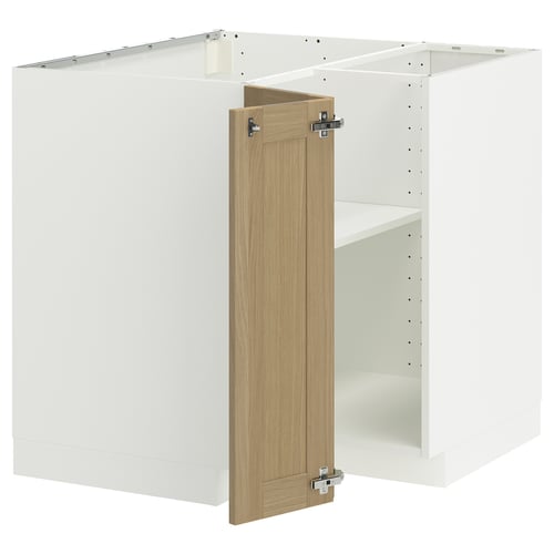 A white METOD kitchen cabinet with an oak door. It a corner base design with a sturdy frame and adjustable shelves.