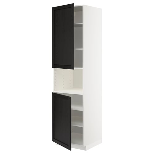 A METOD kitchen cabinet with black-stained ash doors featuring bevelled edges, supported by a white frame.