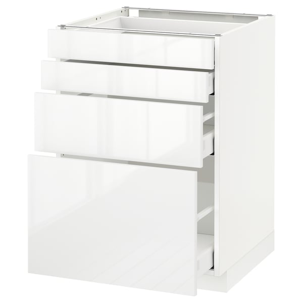 White METOD kitchen cabinet with three open drawers.