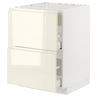 White METOD kitchen unit with high gloss beige drawers and integrated handles.