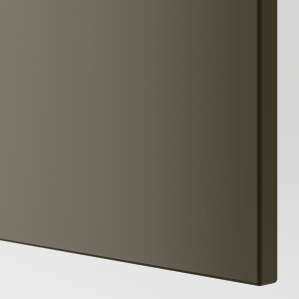 Modern dark kitchen cabinet close-up, smooth finish.