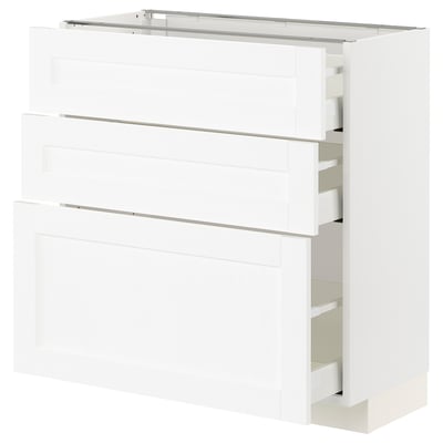 White kitchen cabinet with multiple drawers and shelves.