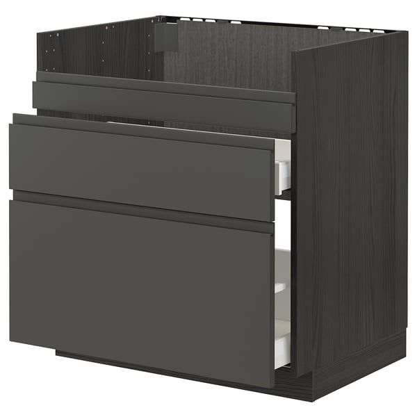 Modern black kitchen cabinet with three drawers and sleek handles.