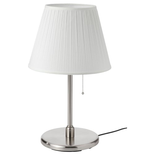 A MYRHULT table lamp with a white pleated lampshade, a nickel-plated base, and a drawstring for operation.