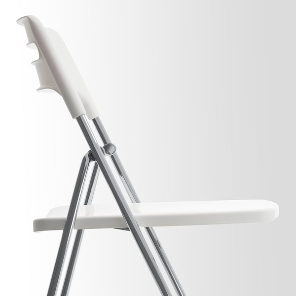 Foldable white chair with grey metal legs, designed for easy storage. Modern, minimalist style.
