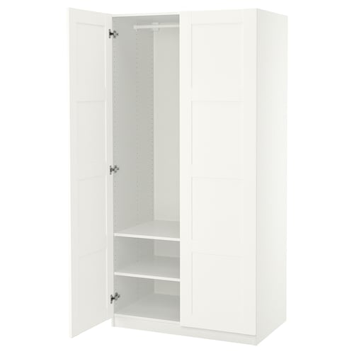 A white ikea PAX wardrobe with one door open, revealing empty shelves and a hanging rod.