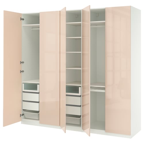 An open, light pink PAX wardrobe with shelves and drawers. It modern design, including soft-closing hinges and adjustable feet.
