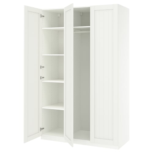 White PAX wardrobe with open doors revealing shelves and hanging rod.