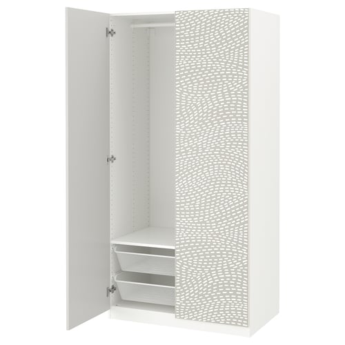 A white PAX wardrobe with a textured door and interior storage shelves, drawers, and rail.
