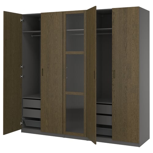 Displays an open wood-toned wardrobe with multiple compartments, including shelves and drawers.