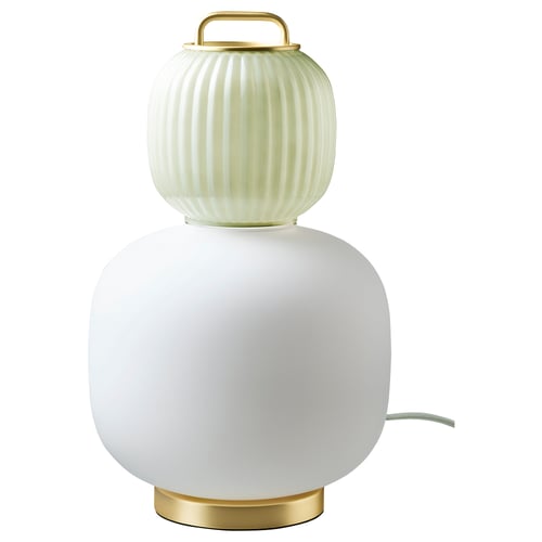 A PILBLIXT lamp with frosted glass and gold accents. It has a unique, timeless lantern design.
