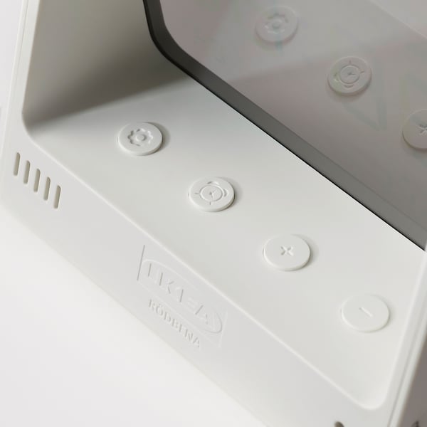 Clear, modern clock with touch buttons showing temperature, humidity, time, and alarm settings.