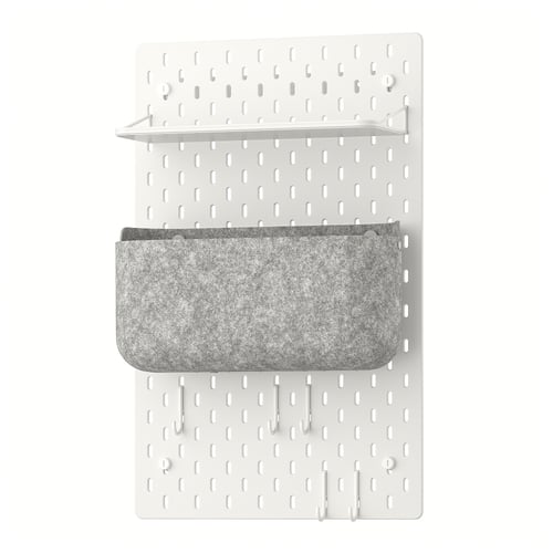 This image shows a white SKÅDIS wall organiser with a shelf and grey fabric pocket.