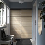 SKYTTA / BOAXEL Reach-in wardrobe with sliding door, black double sided/Mehamn white stained oak effect, 152x65x205 cm