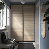 SKYTTA / BOAXEL Reach-in wardrobe with sliding door, black double sided/Mehamn white stained oak effect, 152x65x240 cm
