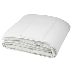 Folded white ikea SMÅSPORRE recycled comforter on white background.